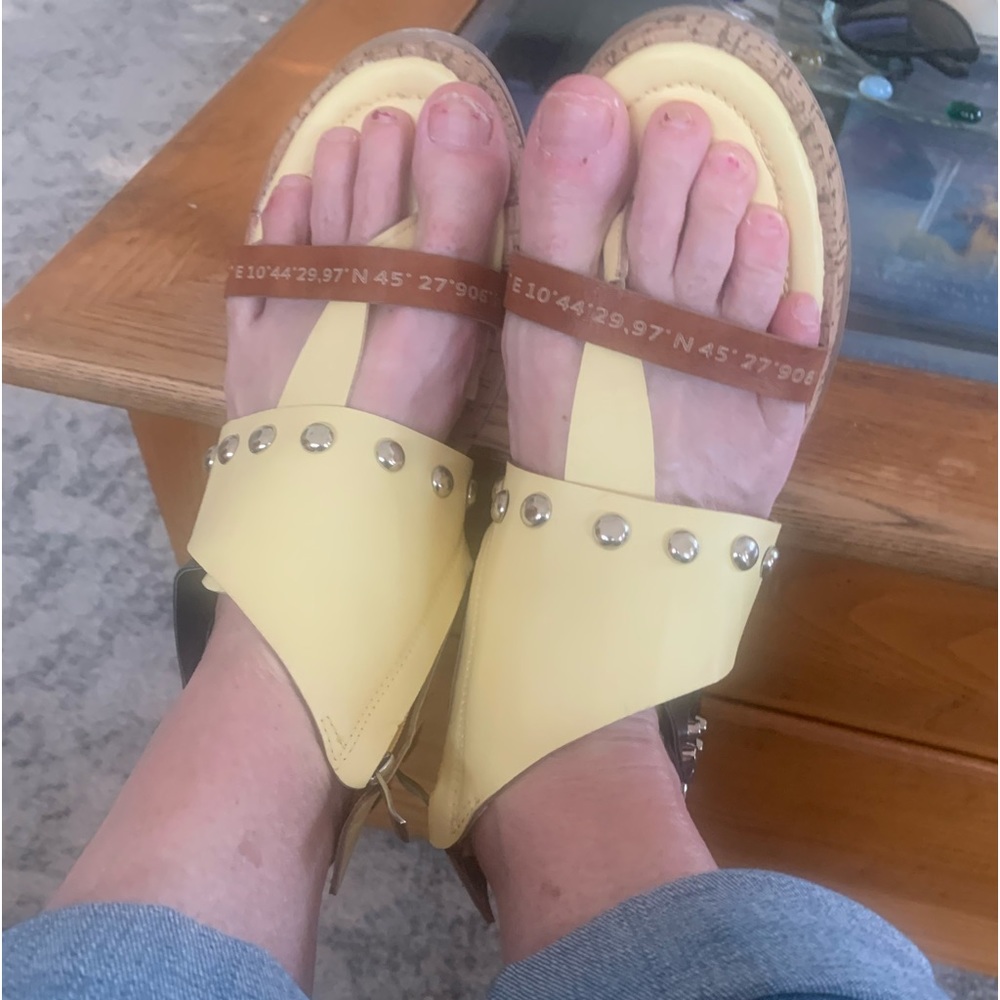 These shoes are so comfortable. Soft yellow. Cork lining- very gently used.